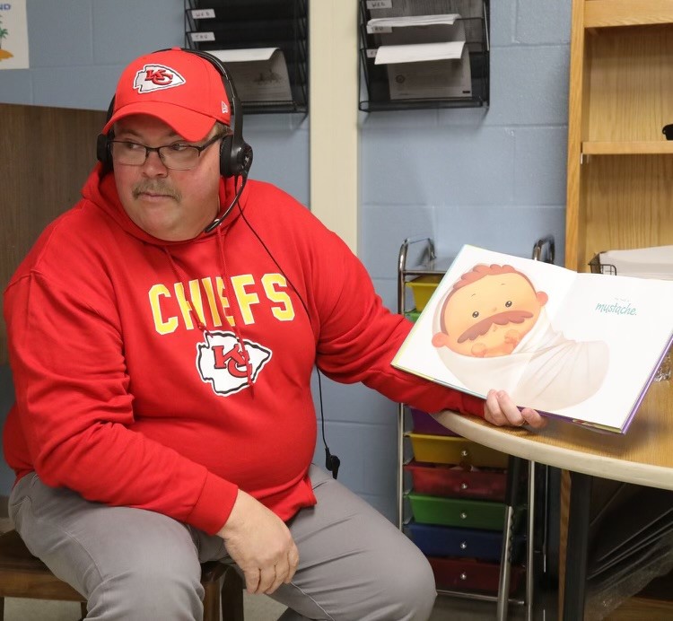 Coach “Read” attends family reading night